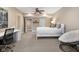 Serene bedroom with white furniture, desk, and chair, with a papasan chair providing extra comfort and style at 995 Westlake Hills Dr, Columbus, IN 47201