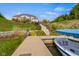 Serene backyard with boat dock, lush landscaping, and easy access to the water at 995 Westlake Hills Dr, Columbus, IN 47201