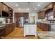 Spacious kitchen features stainless steel appliances, custom cabinets, and a large island at 995 Westlake Hills Dr, Columbus, IN 47201