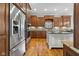 Gourmet kitchen with stainless steel appliances, custom cabinetry, and center island at 995 Westlake Hills Dr, Columbus, IN 47201
