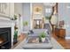 Stylish living room with a cozy fireplace, elegant decor, and ample natural light at 995 Westlake Hills Dr, Columbus, IN 47201