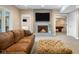 Inviting living room showcasing a stone fireplace, comfortable seating, and neutral decor at 995 Westlake Hills Dr, Columbus, IN 47201