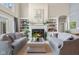 Bright living room featuring a fireplace, built-in shelves, and comfortable seating at 995 Westlake Hills Dr, Columbus, IN 47201