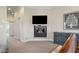 The large primary bedroom boasts a modern fireplace, media center, and ample space at 995 Westlake Hills Dr, Columbus, IN 47201