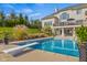 Backyard oasis featuring a diving pool, pristine landscaping, and a serene outdoor setting at 995 Westlake Hills Dr, Columbus, IN 47201