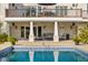 Relaxing poolside patio with comfortable seating, ceiling fans, and views of the refreshing pool at 995 Westlake Hills Dr, Columbus, IN 47201