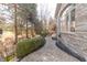 Beautiful backyard with brick exterior, paver path, hot tub under gazebo, and professionally landscaped grounds at 1115 Morningside Ct, Greenfield, IN 46140