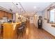 Finished basement features a bar with wood flooring, cabinetry, unique lighting, and gas pump decor at 1115 Morningside Ct, Greenfield, IN 46140