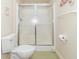 Compact bathroom featuring a glass-enclosed shower and toilet with a neutral color scheme at 1115 Morningside Ct, Greenfield, IN 46140