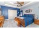 Spacious bedroom featuring tray ceilings, fan, and neutral carpeting at 1115 Morningside Ct, Greenfield, IN 46140