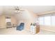 Attic bedroom with neutral walls, a ceiling fan, natural light and two chairs at 1115 Morningside Ct, Greenfield, IN 46140