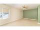 Neutral-colored bedroom with tan carpeting, and a ceiling fan at 1115 Morningside Ct, Greenfield, IN 46140