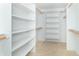 Spacious walk-in closet features built-in shelving and ample storage, ideal for organized living at 1115 Morningside Ct, Greenfield, IN 46140