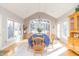 Bright dining room with large windows, light wood furniture, and hardwood floors at 1115 Morningside Ct, Greenfield, IN 46140