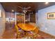 Elegant dining room features a wine bar area, wood floors, and a ceiling fan at 1115 Morningside Ct, Greenfield, IN 46140