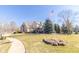 Spacious home with well-manicured lawn and landscaping, accented by an American flag at 1115 Morningside Ct, Greenfield, IN 46140