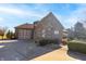 Brick house featuring an attached three-car garage and well-kept landscaping at 1115 Morningside Ct, Greenfield, IN 46140