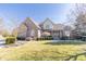Charming two-story brick home with a welcoming front porch and well-maintained lawn at 1115 Morningside Ct, Greenfield, IN 46140