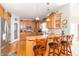 Modern kitchen with stainless steel appliances, granite countertops, and breakfast bar with barstool seating at 1115 Morningside Ct, Greenfield, IN 46140