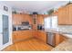 Traditional kitchen with wood cabinets, stainless steel appliances, and granite countertops at 1115 Morningside Ct, Greenfield, IN 46140