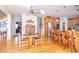 Open kitchen area with breakfast bar and hardwood floors, adjacent to living area at 1115 Morningside Ct, Greenfield, IN 46140