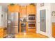 Updated kitchen featuring stainless steel appliances, including a refrigerator, wine cooler and double oven at 1115 Morningside Ct, Greenfield, IN 46140