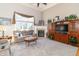 Bright living room with fireplace, large windows, plush seating, and built-in shelving at 1115 Morningside Ct, Greenfield, IN 46140