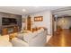 Relaxing living area with comfortable seating, a fireplace, and seamless access to other living spaces at 1115 Morningside Ct, Greenfield, IN 46140