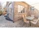Cozy outdoor patio with brick paving, surrounded by lush greenery and brick walls at 1115 Morningside Ct, Greenfield, IN 46140
