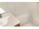 Bright bathroom featuring a white toilet and vanity, offering a clean and functional space at 1149 W 28Th St, Indianapolis, IN 46208