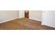 Clean bedroom with neutral carpet and freshly painted walls, featuring two doors at 1149 W 28Th St, Indianapolis, IN 46208