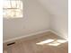 Sunlit bedroom featuring carpet flooring, neutral paint, and a window with views of the surrounding area at 1149 W 28Th St, Indianapolis, IN 46208