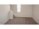 Hallway with neutral walls and carpet leading to carpeted stairs at 1149 W 28Th St, Indianapolis, IN 46208