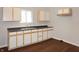 Bright kitchen features white cabinets, neutral walls, and a window over sink at 1149 W 28Th St, Indianapolis, IN 46208