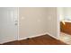 Functional laundry room with hardwood flooring, complete with fixtures and access to a bathroom at 1149 W 28Th St, Indianapolis, IN 46208