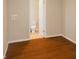 Spacious laundry room that offers hardwood flooring and a view of the bathroom. Perfect for chores and convenience at 1149 W 28Th St, Indianapolis, IN 46208