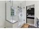 Modern shower featuring glass enclosure and tiled walls, adjacent to the main bedroom at 11907 Ledgestone Cir, Fishers, IN 46037