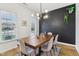 Modern dining room features a wooden table, stylish chairs, and contemporary lighting for elegant meals at 11907 Ledgestone Cir, Fishers, IN 46037