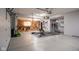 Functional garage space with work area, exercise equipment, and organized storage solutions at 11907 Ledgestone Cir, Fishers, IN 46037