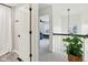 Bright hallway with view to bedroom is decorated with a potted plant, adding a touch of nature at 11907 Ledgestone Cir, Fishers, IN 46037