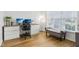 Bright home office with a built-in desk, comfortable chair, and large window providing natural light and workspace at 11907 Ledgestone Cir, Fishers, IN 46037