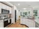 Charming kitchen features stainless steel appliances, granite countertops, and a cozy breakfast nook at 11907 Ledgestone Cir, Fishers, IN 46037