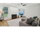 Comfortable living area with a fireplace, large windows, and stylish decor at 11907 Ledgestone Cir, Fishers, IN 46037