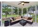 Relaxing screened-in porch with comfortable seating and scenic views of the water at 11907 Ledgestone Cir, Fishers, IN 46037