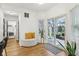 Bright sunroom features natural light, stylish seating, and a sliding glass door to the outdoor patio at 11907 Ledgestone Cir, Fishers, IN 46037