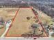 Aerial view of a large parcel of land showcasing its expansive size with residential property at 1229 N German Church Rd, Indianapolis, IN 46229