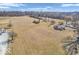 Scenic aerial view showcases a home nestled on a sprawling lot with mature trees and open space at 1229 N German Church Rd, Indianapolis, IN 46229