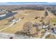 Wide aerial view of homes on expansive land, showcasing a peaceful and secluded neighborhood at 1229 N German Church Rd, Indianapolis, IN 46229