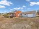 Cozy brick home with a single-car detached garage, and mature landscaping at 1229 N German Church Rd, Indianapolis, IN 46229