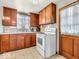This kitchen offers wood cabinets and a white range oven at 1229 N German Church Rd, Indianapolis, IN 46229